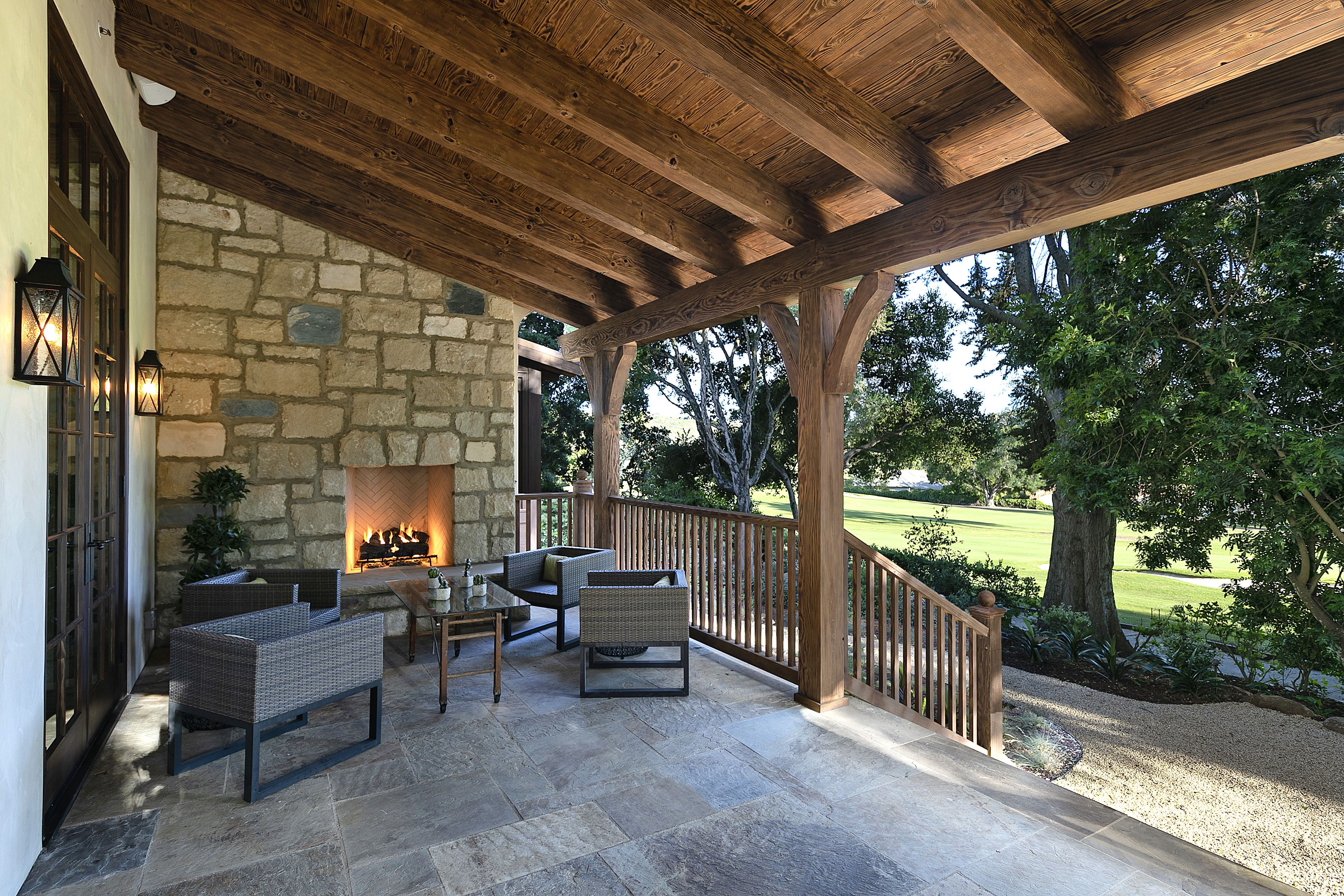 covered patio seating with fireplace